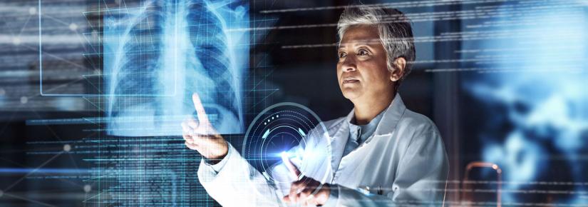 A doctor examines a lung xray in a hologram setting surrounded by images of data.