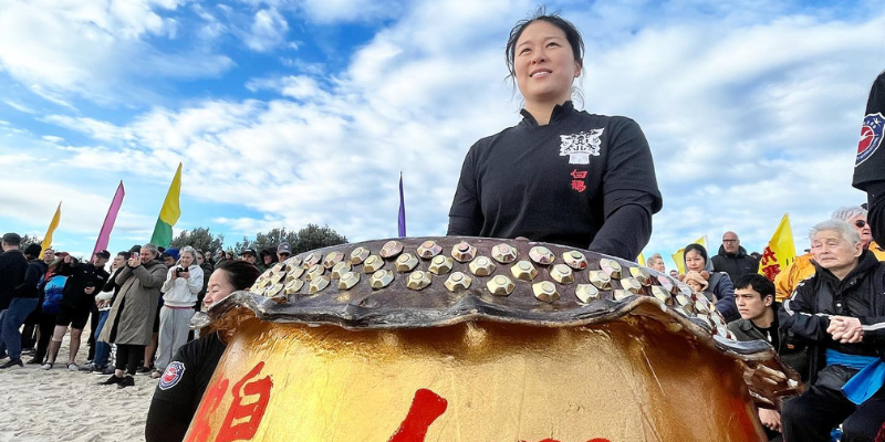 Person behind tradition musical drum 