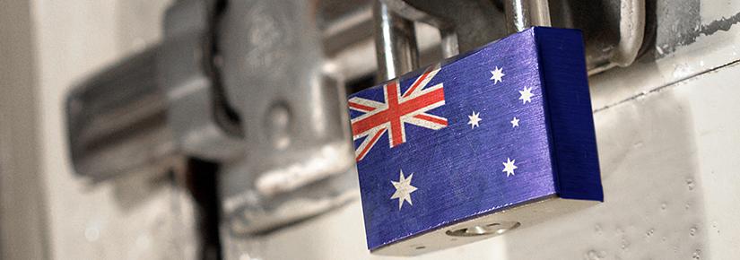 Stock picture of a padlocked door with the Australian national flag on the padlock