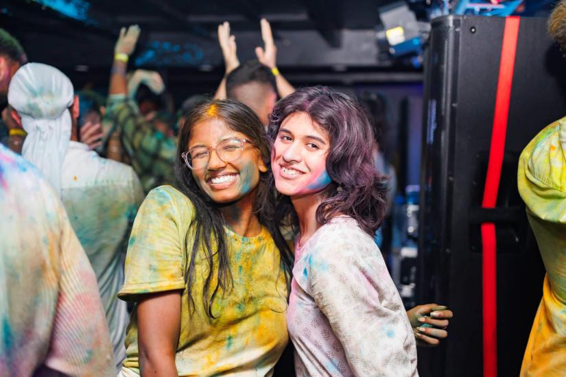 Two students celebrating Holi Festival