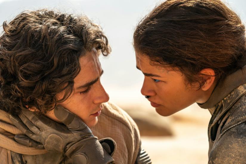 Production still from Dune: Part Two of Paul Atreides, played by Timothée Chalamet and Chani, played by Zendaya