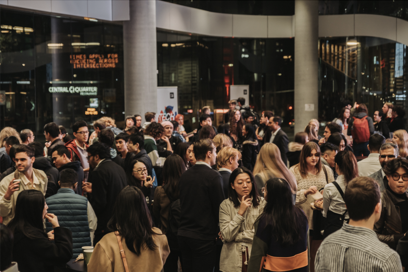 Image of the UTS Tech Festival Awards Night in the foyer. A large group of people are chatting, networking and eating canapes.