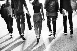 Group of young people walking on a street