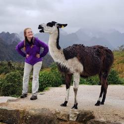 Velvet-Belle posing on a mountain with a llama
