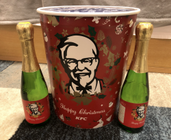 A KFC bucket and wine with Christmas packaging