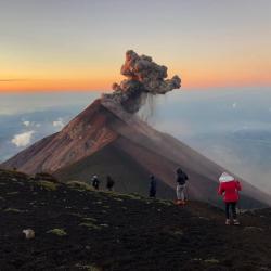 A volcano with smoke billowing out