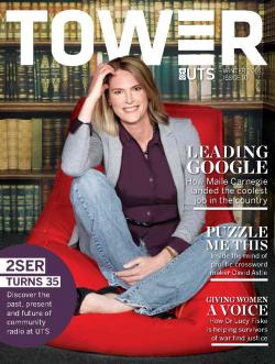 Cover page of Tower Issue 10 featuring Maile Carnegie smiling at the camera whilst sitting on a red beanbag in front a bookshelf