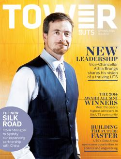 Cover page of Tower Issue 11 featuring Professor Attila Brungs smiling at the camera against a yellow wooden background