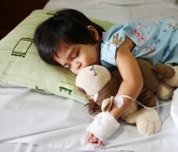 Sleeping child in hospital bed