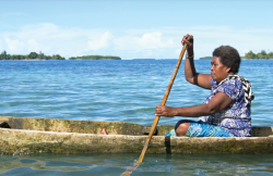 Pacific Islands woman paddling in a canoe