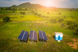 Aerial drone shot of solar panels as a renewable energy source in remote areas of Tanzania
