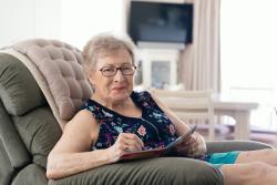 Older woman in armchair