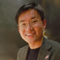 Headshot image of Dr Shulin (Stanley) Chen against a dark background
