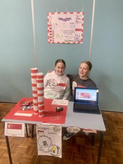 Two school students showing their project
