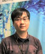 Prof JQ Zhang in a relaxed pose looking directly at the camera