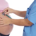 pregnant woman inspected by doctor